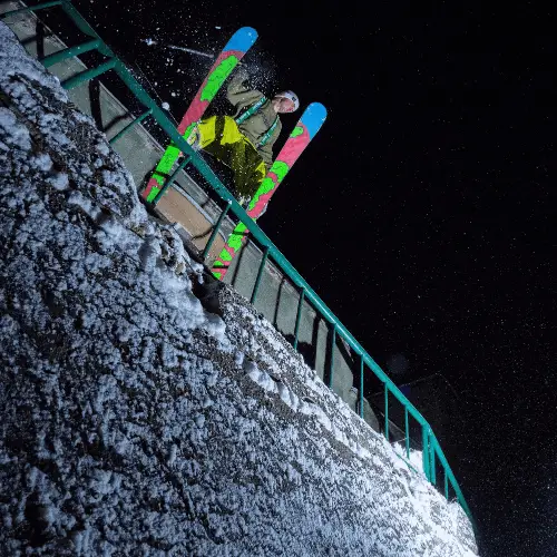 Skier sliding a handrail.